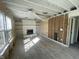 Living room with fireplace and built-in shelves, ready for renovation at 12151 Bearsdale Dr, Indianapolis, IN 46235