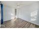 Spacious bedroom featuring a ceiling fan, closet, and laminate flooring at 1239 Brooks St, Indianapolis, IN 46202