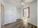 This bedroom features hardwood flooring, a window, white ceilings, a closet and white walls at 1239 Brooks St, Indianapolis, IN 46202