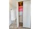 Open closet with built-in shelving and pink accents at 1239 Brooks St, Indianapolis, IN 46202