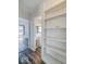 Hallway with hardwood-style floors and a view into the bathroom and bedroom at 1239 Brooks St, Indianapolis, IN 46202