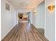 Inviting hallway leading to a cozy Gathering room with stone fireplace at 1239 Brooks St, Indianapolis, IN 46202