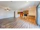 Open-concept living room with a stone fireplace and wood floors at 1239 Brooks St, Indianapolis, IN 46202