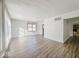 Bright, spacious living room with wood floors and lots of natural light at 1239 Brooks St, Indianapolis, IN 46202