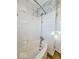 Bathroom featuring a white tiled shower and a metal showerhead at 1239 Brooks St, Indianapolis, IN 46202