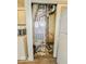 Utility closet featuring new furnace, laundry machine, and a microwave at 1239 Brooks St, Indianapolis, IN 46202