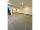 A spacious, carpeted basement with a staircase, perfect for recreation or storage at 12461 Hawks Landing Dr, Fishers, IN 46037