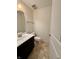 A half bathroom features a modern vanity with sink and neutral finishes at 12461 Hawks Landing Dr, Fishers, IN 46037
