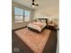 Cozy bedroom featuring a large window, plush carpet, and neutral colors at 12461 Hawks Landing Dr, Fishers, IN 46037