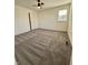 Empty bedroom featuring plush carpeting, natural light, and neutral walls at 12461 Hawks Landing Dr, Fishers, IN 46037