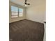 A bright bedroom with plush carpeting and large windows that let in natural light at 12461 Hawks Landing Dr, Fishers, IN 46037