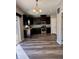 View of the kitchen featuring stainless steel appliances and dark wood cabinetry at 12461 Hawks Landing Dr, Fishers, IN 46037