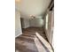 View of the empty living room with sleek wood floors, ceiling fan and sliding glass doors at 12461 Hawks Landing Dr, Fishers, IN 46037