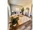 View of the staged living room featuring sleek wood floors and lots of natural light at 12461 Hawks Landing Dr, Fishers, IN 46037
