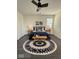 Bright main bedroom with stylish decor, modern ceiling fan, and comfortable furnishings at 12461 Hawks Landing Dr, Fishers, IN 46037