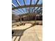 A backyard concrete patio with a pergola and view of lawn and trees at 12461 Hawks Landing Dr, Fishers, IN 46037