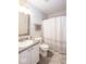 Cozy bathroom with a sleek vanity, modern fixtures, and stylish shower curtain at 13414 Allegiance Dr, Fishers, IN 46037