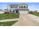 Attractive two-story home with a well-maintained lawn and a two-car garage at 13860 N Tiosa Ln, Camby, IN 46113