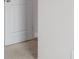 Hallway showing a white wall, door, and beige carpet at 13860 N Tiosa Ln, Camby, IN 46113