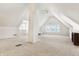 Bright, expansive bonus room with dormer windows, carpeted floors, and a central column at 139 S Ritter Ave, Indianapolis, IN 46219