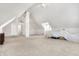 Large bonus room featuring neutral carpet, a painted brick support column, and ample natural light at 139 S Ritter Ave, Indianapolis, IN 46219