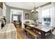 Charming dining room featuring hardwood floors, a large wooden table, and a cozy atmosphere at 139 S Ritter Ave, Indianapolis, IN 46219