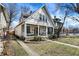 Lovely two-story home featuring a classic front porch swing and seating, set on a well-manicured lawn at 139 S Ritter Ave, Indianapolis, IN 46219