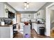Updated kitchen featuring modern appliances, white cabinets, and a dark countertop at 139 S Ritter Ave, Indianapolis, IN 46219