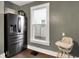 Bright kitchen featuring stainless steel appliances, natural light, and updated flooring at 139 S Ritter Ave, Indianapolis, IN 46219