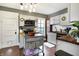 Well-lit kitchen features white cabinets, butcher block counters, and a movable gray island at 139 S Ritter Ave, Indianapolis, IN 46219