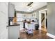 Updated kitchen with stainless steel appliances and a kitchen island with added shelving at 139 S Ritter Ave, Indianapolis, IN 46219