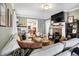 Comfortable living room with hardwood floors, a fireplace, and stylish decor at 139 S Ritter Ave, Indianapolis, IN 46219