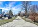 A pleasant neighborhood street view on a sunny day with blue skies and a tree-lined sidewalk at 139 S Ritter Ave, Indianapolis, IN 46219