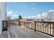 View of the back deck, which is made of wood, and it overlooks the adjacent houses at 1413 S East St, Indianapolis, IN 46225