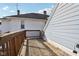 View of the back deck, which is made of wood, and it overlooks the adjacent houses at 1413 S East St, Indianapolis, IN 46225