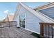 View of the back deck, which is made of wood and a sliding glass door is visible at 1413 S East St, Indianapolis, IN 46225
