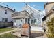 Charming home featuring a backyard with a wooden deck, fire pit, and second story balcony at 1413 S East St, Indianapolis, IN 46225