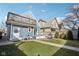 Backyard area with lush grass, a fire pit, a patio set and a balcony off the second level at 1413 S East St, Indianapolis, IN 46225