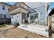 Backyard patio with a deck and an outdoor seating area with string lights at 1413 S East St, Indianapolis, IN 46225