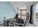 Cozy bedroom featuring a desk area, slanted walls, and natural light at 1413 S East St, Indianapolis, IN 46225
