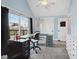 Well-lit bedroom featuring a work space, closet, and an exit to the balcony at 1413 S East St, Indianapolis, IN 46225