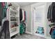 Walk-in closet with built-in shelving and hanging racks for ample storage space at 1413 S East St, Indianapolis, IN 46225