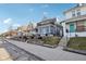 Street view showcasing the house with a balcony and landscaped front yard, blending seamlessly into a friendly neighborhood at 1413 S East St, Indianapolis, IN 46225