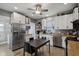 Bright kitchen featuring white cabinets, stainless steel appliances, and a center island at 1413 S East St, Indianapolis, IN 46225