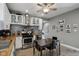 Updated kitchen boasts stainless steel appliances, white cabinetry, and butcher block countertops at 1413 S East St, Indianapolis, IN 46225