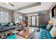 Comfortable living room with modern furniture, stylish decor, and a decorative glass front door at 1413 S East St, Indianapolis, IN 46225