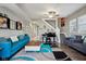 Bright and airy living room featuring modern decor, a piano, and a comfortable seating area at 1413 S East St, Indianapolis, IN 46225