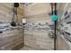 Nicely tiled shower with sleek hardware, soap caddy, and mosaic tile accents at 1413 S East St, Indianapolis, IN 46225
