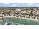 An aerial view showcasing a residential area adjacent to a pond and business district at 15745 Market Center Dr, Carmel, IN 46033