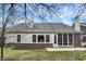 Home exterior featuring a brick-lined patio and screened-in porch at 15745 Market Center Dr, Carmel, IN 46033